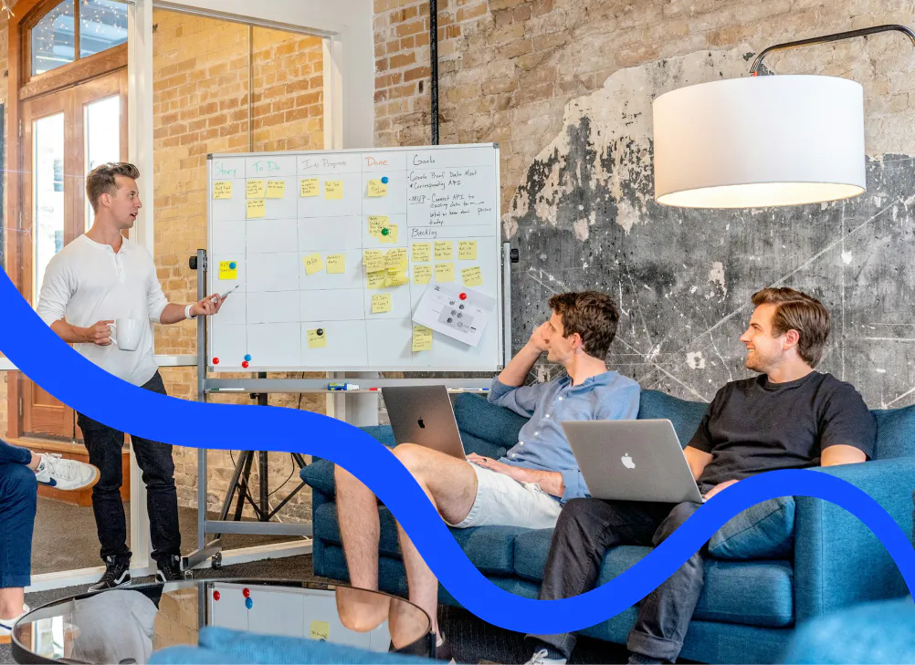 A team planning the next automations at a board of sticky notes