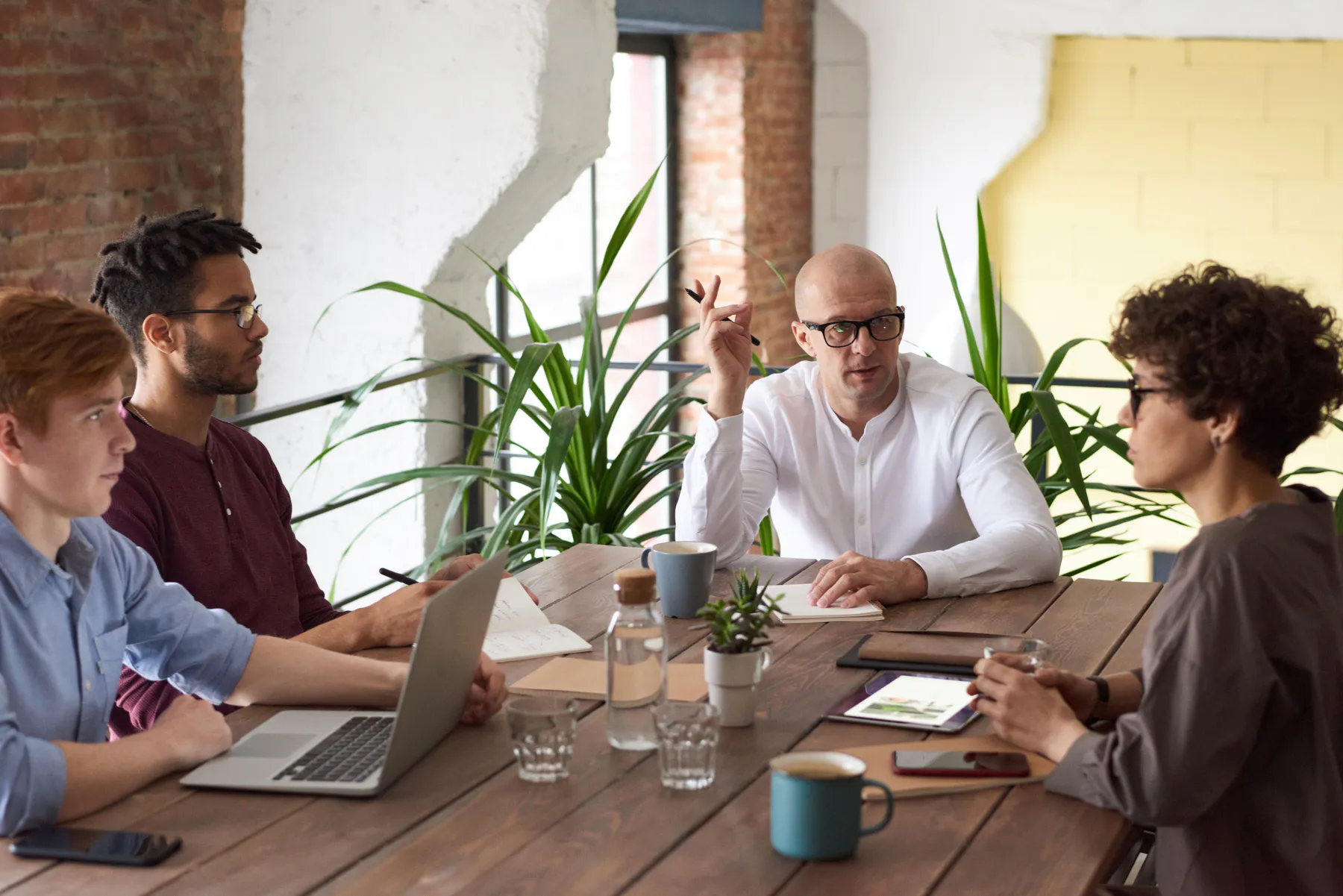 The Flero team in a meeting around a table